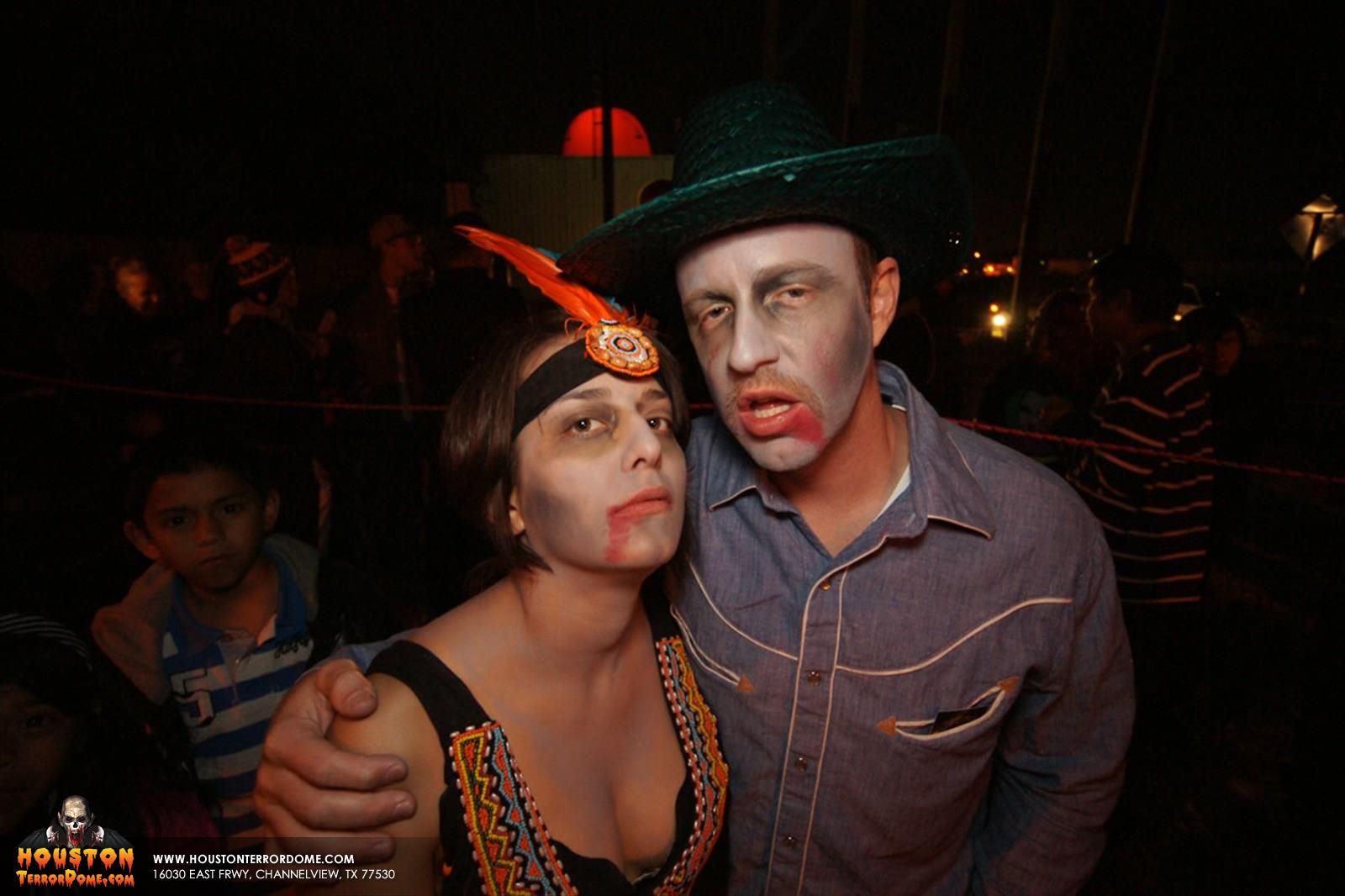 Couple dressed up waiting to be scared. 